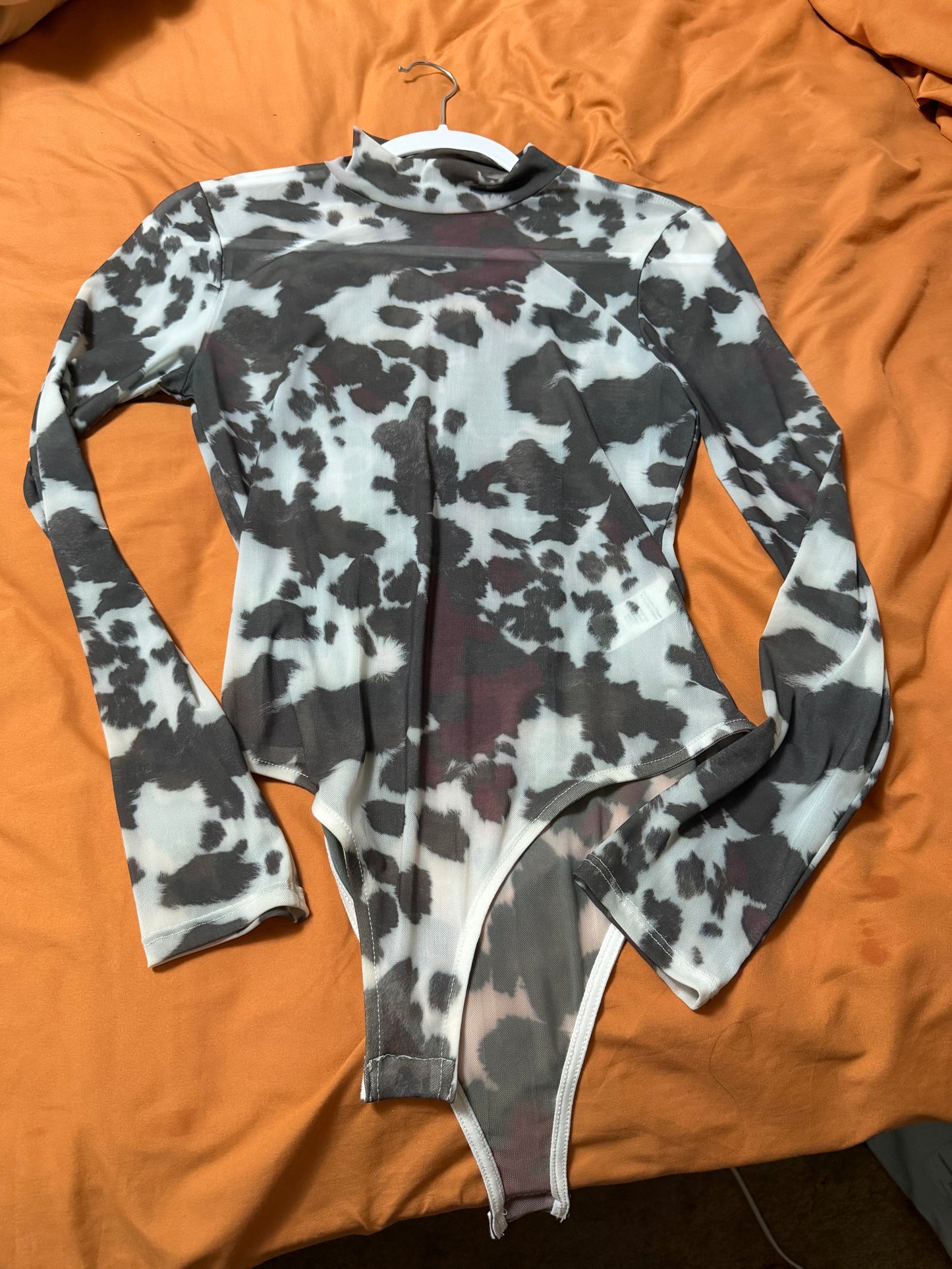medium cow print body suit